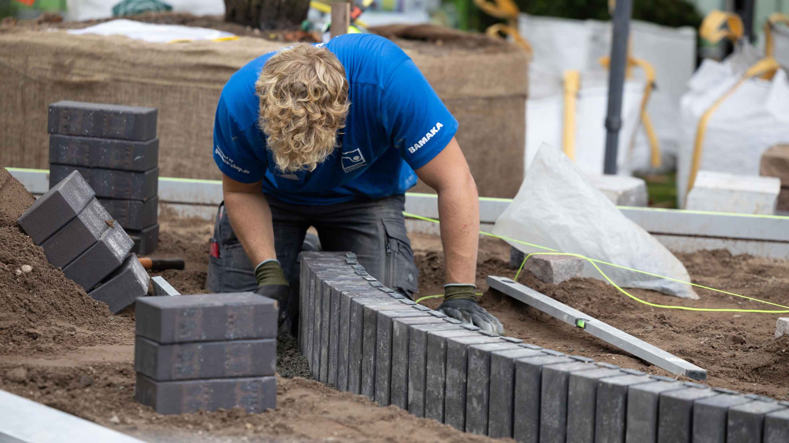 An exhibitor building a garden
